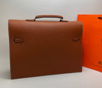 Hermes brown leather briefcase back view with corner handles and stitched flap