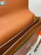 Hermes brown leather briefcase close-up of interior lining and edge stitching