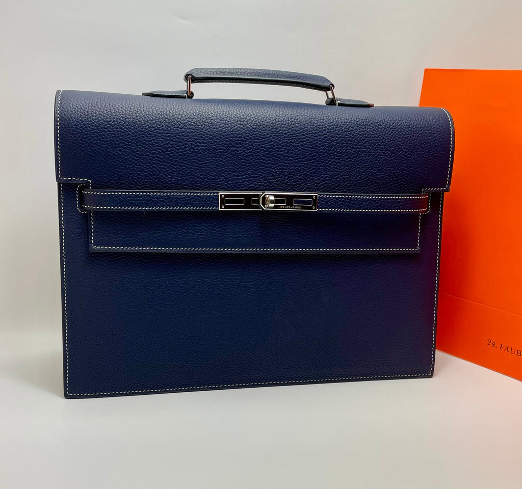 Hermes blue leather bag with top handle and front flap clasp