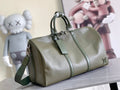 Men's Louis Vuitton duffel bag in olive green leather with top handles and front zip