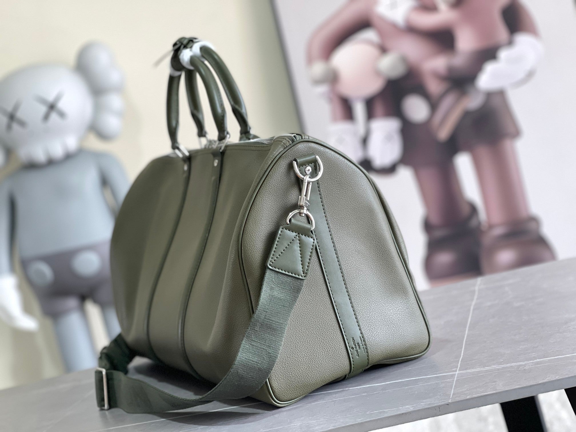 Men's Louis Vuitton duffel bag, olive green leather with shoulder strap and top handle