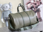 Men's Louis Vuitton duffel bag in olive green leather with crossbody strap and zipper