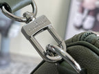 Men's Louis Vuitton duffel bag clasp close-up with silver-tone metal hardware