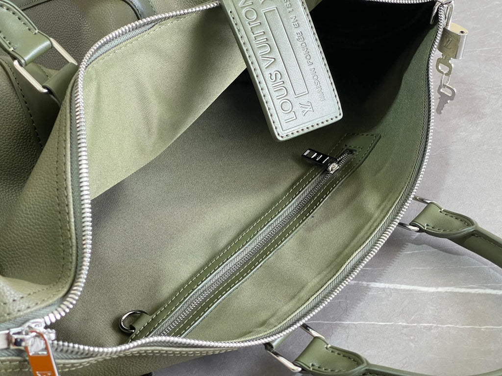Men's Louis Vuitton duffel bag interior zip pocket with hanging leather tag