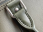 Men's Louis Vuitton duffel bag strap loop with stitched leather panel on olive green