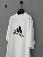 White short-sleeve T-shirt with large black and red Balenciaga logo