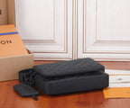 Black monogram crossbody bag with foldover flap top and detachable strap accessory