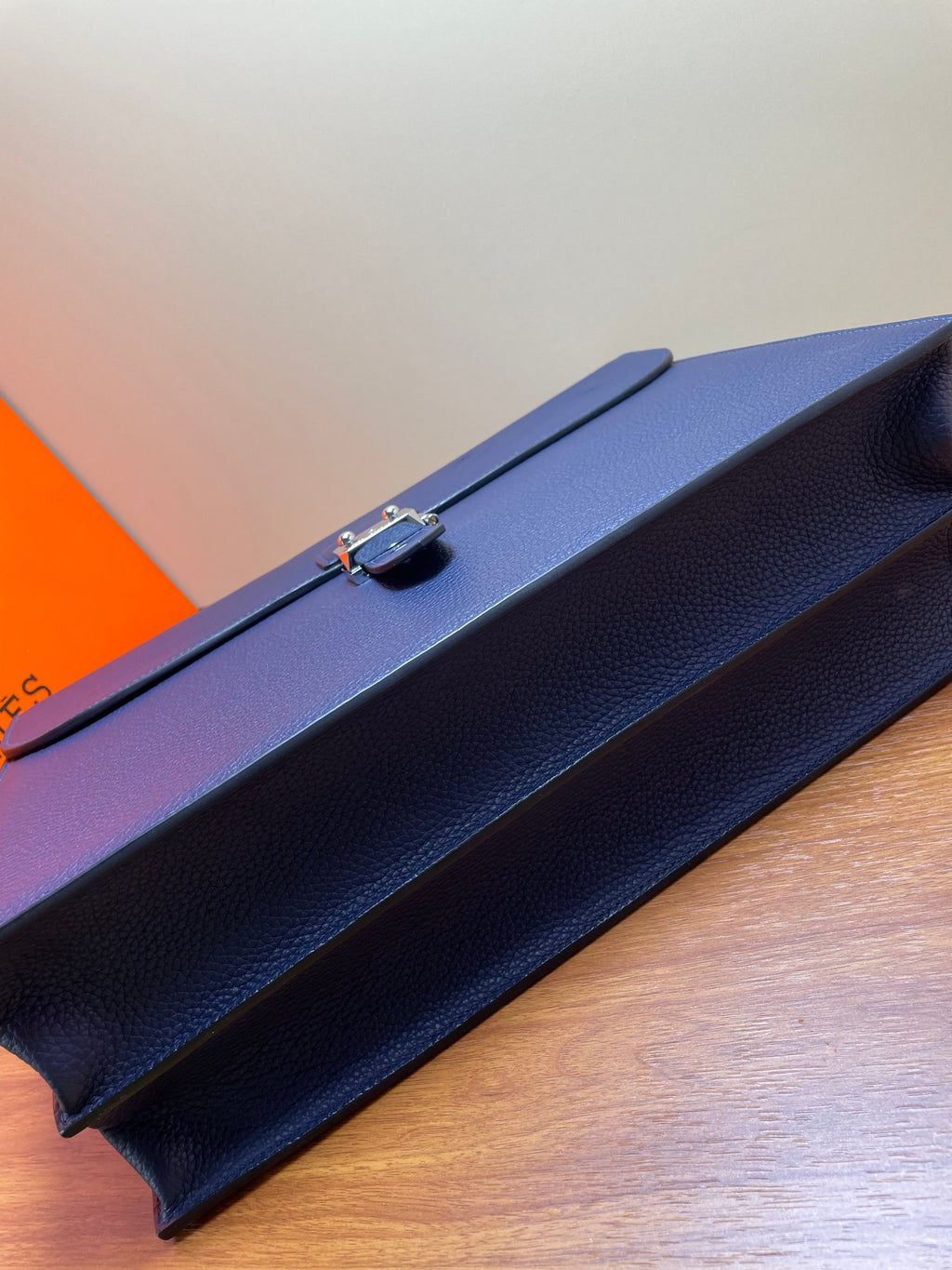Hermes briefcase bag in textured blue leather, top edge with handle and metal clasp