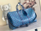 Louis Vuitton men’s duffel bag in blue with monogram print and top handles
