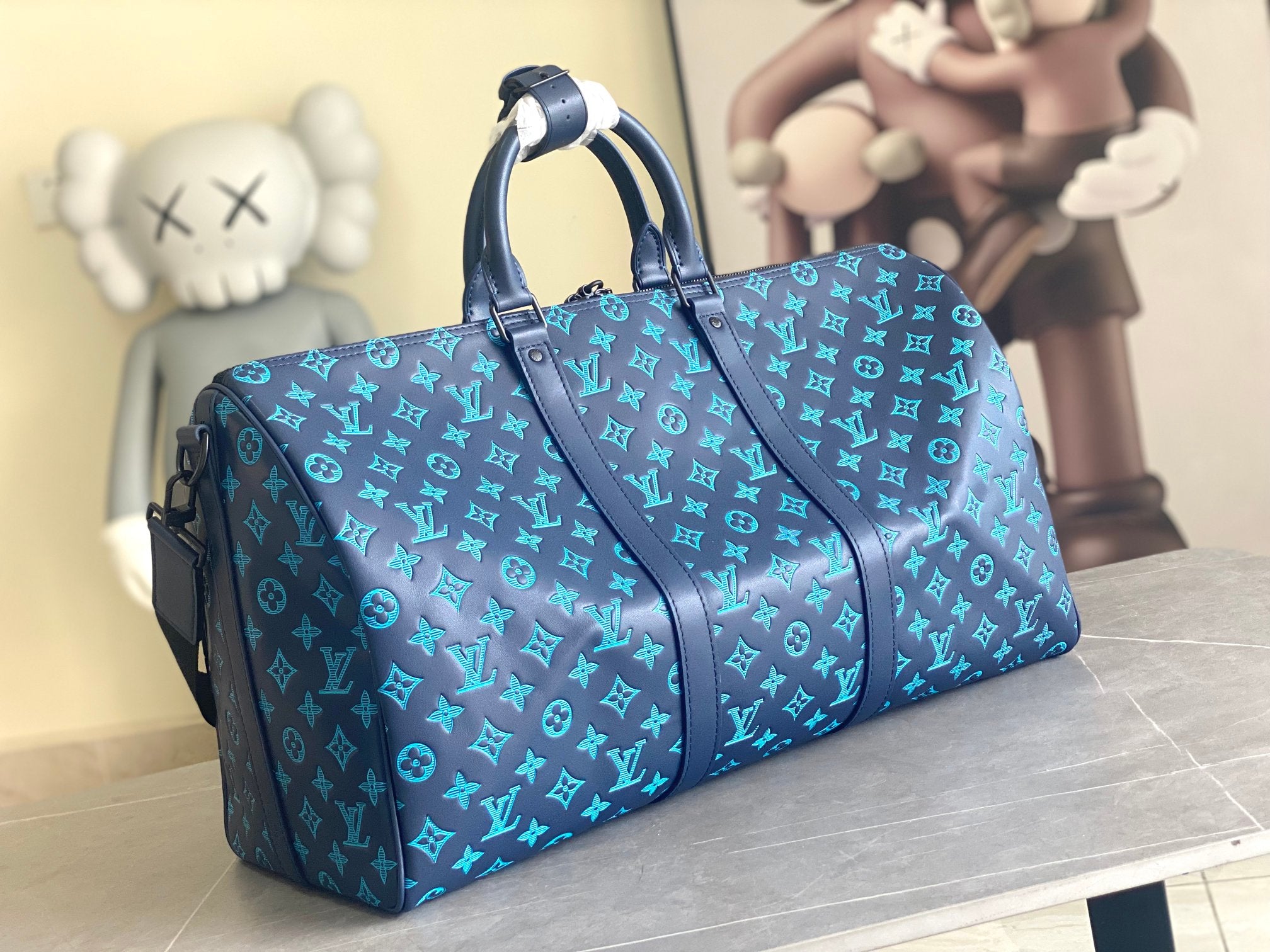 Louis Vuitton men’s duffel bag in blue monogram with top handles and front zipper pocket
