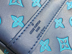 Louis Vuitton duffel bag blue leather patch with embossed brand name and stitched seam