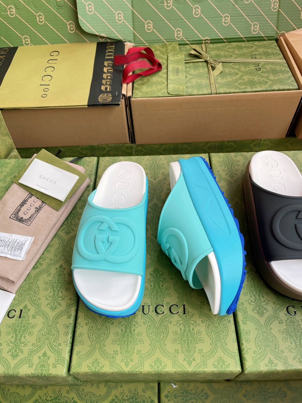 Gucci logo slide sandals, aqua blue straps with white cushioned footbed