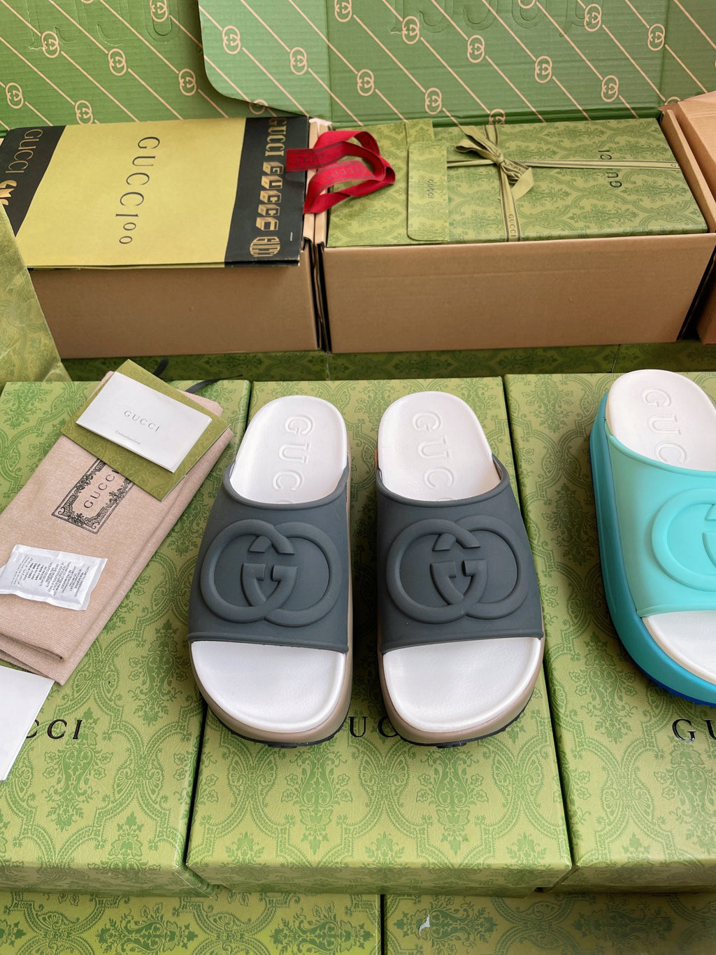 Gucci logo slide sandals, dark gray slides with white cushioned footbed