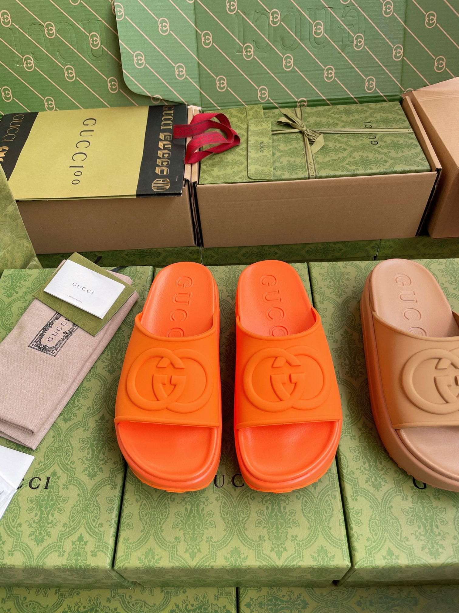 Gucci logo slide sandals, bright orange slides with cushioned footbed