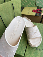 White GG logo slide sandals, textured footbed with embossed logo detail