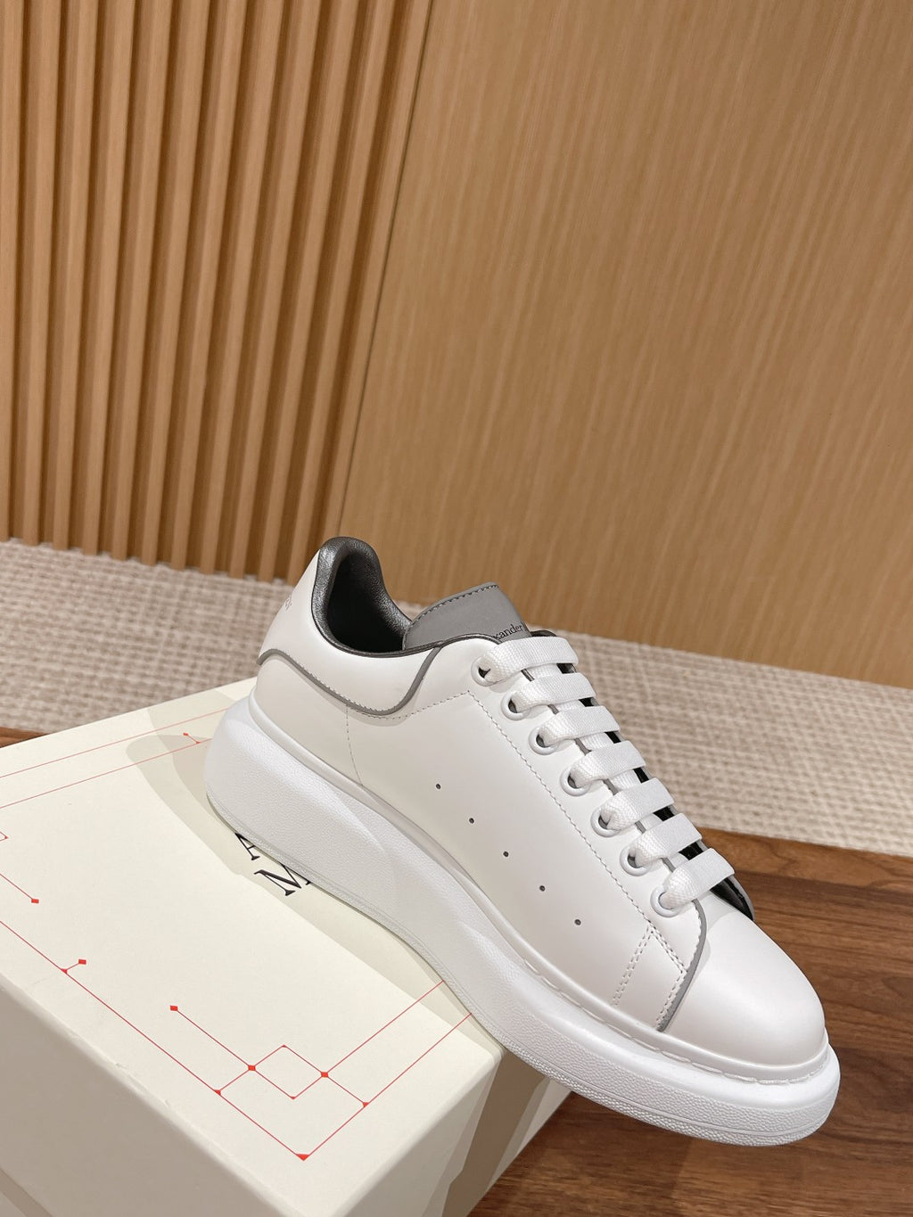 White leather sneaker with gray collar lining and white lace-up, Alexander McQueen