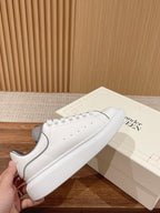 White leather sneakers with gray heel and laces, Alexander McQueen
