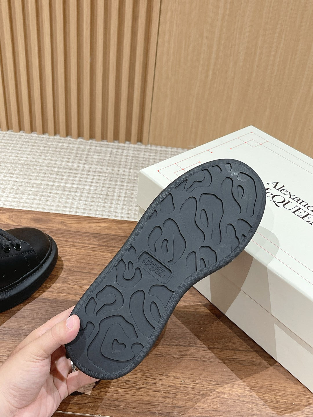 Black rubber outsole with patterned tread for grip