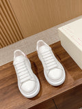Alexander McQueen leather sneakers, white with lace-up front and thick sole
