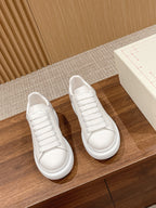 White leather lace-up sneakers, rounded toe and white rubber sole
