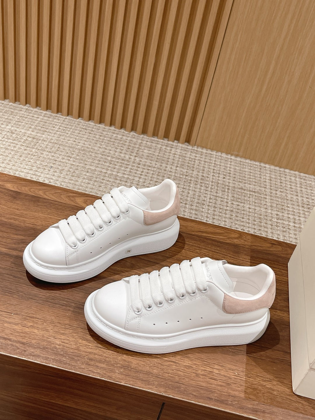 White leather sneakers with lace-up vamp and thick white sole