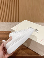 Alexander McQueen low-top sneakers, white leather with perforated toe and lace eyelets