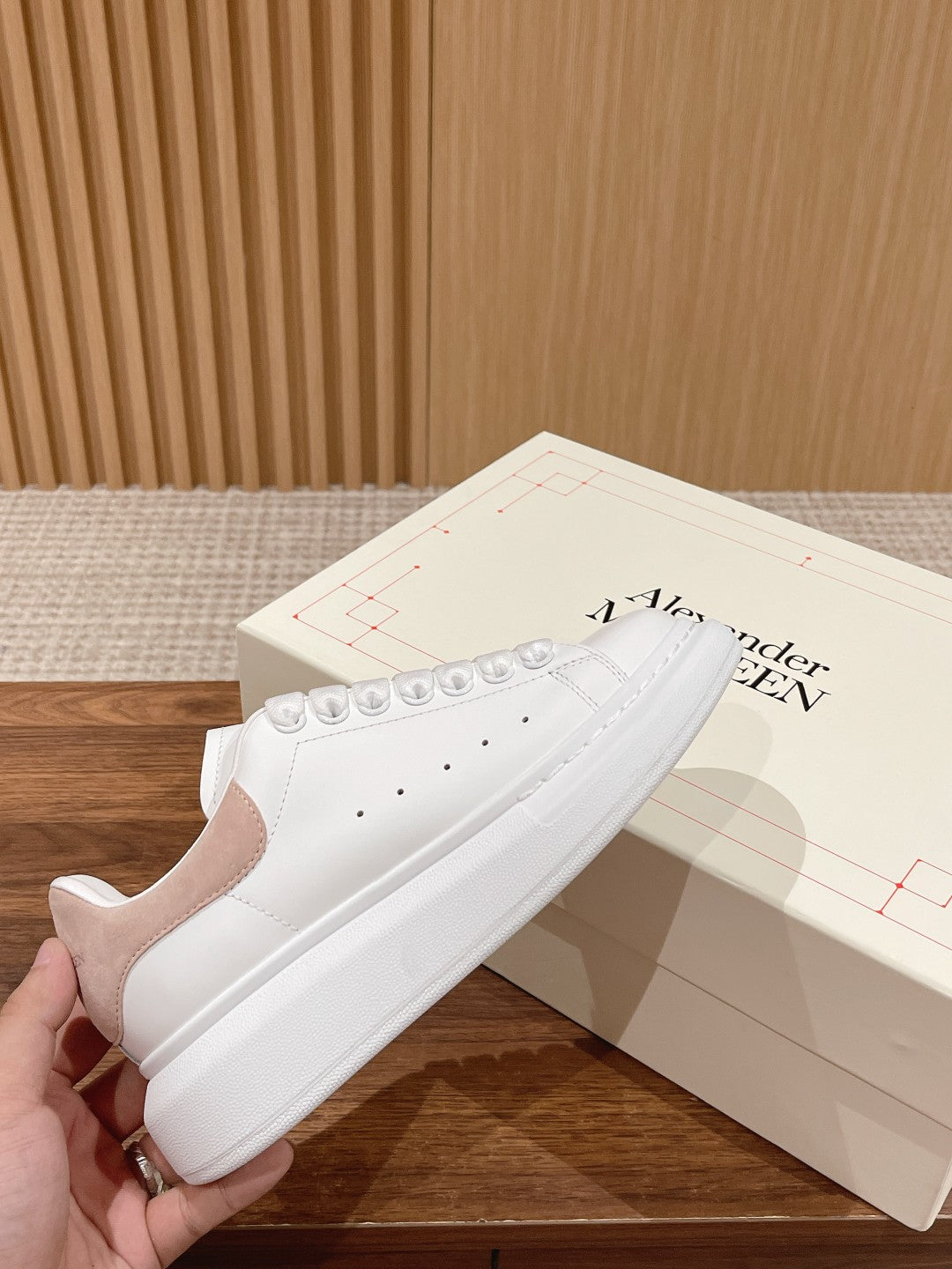 Alexander McQueen low-top sneakers, white leather with perforated toe and lace eyelets