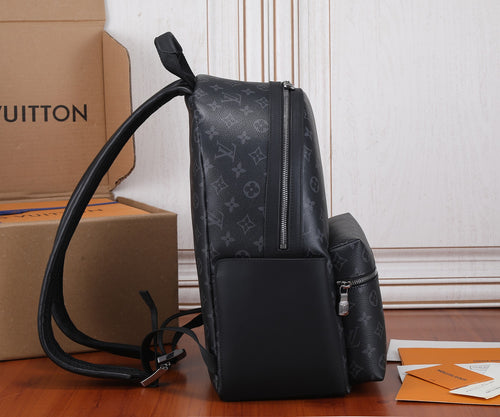 Black Louis Vuitton monogram backpack with side pocket and adjustable shoulder straps