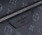 Black Louis Vuitton monogram zip pocket with embossed “Louis Vuitton Paris” label