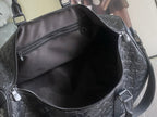 Louis Vuitton duffel bag interior opening with black lining and zipper pocket