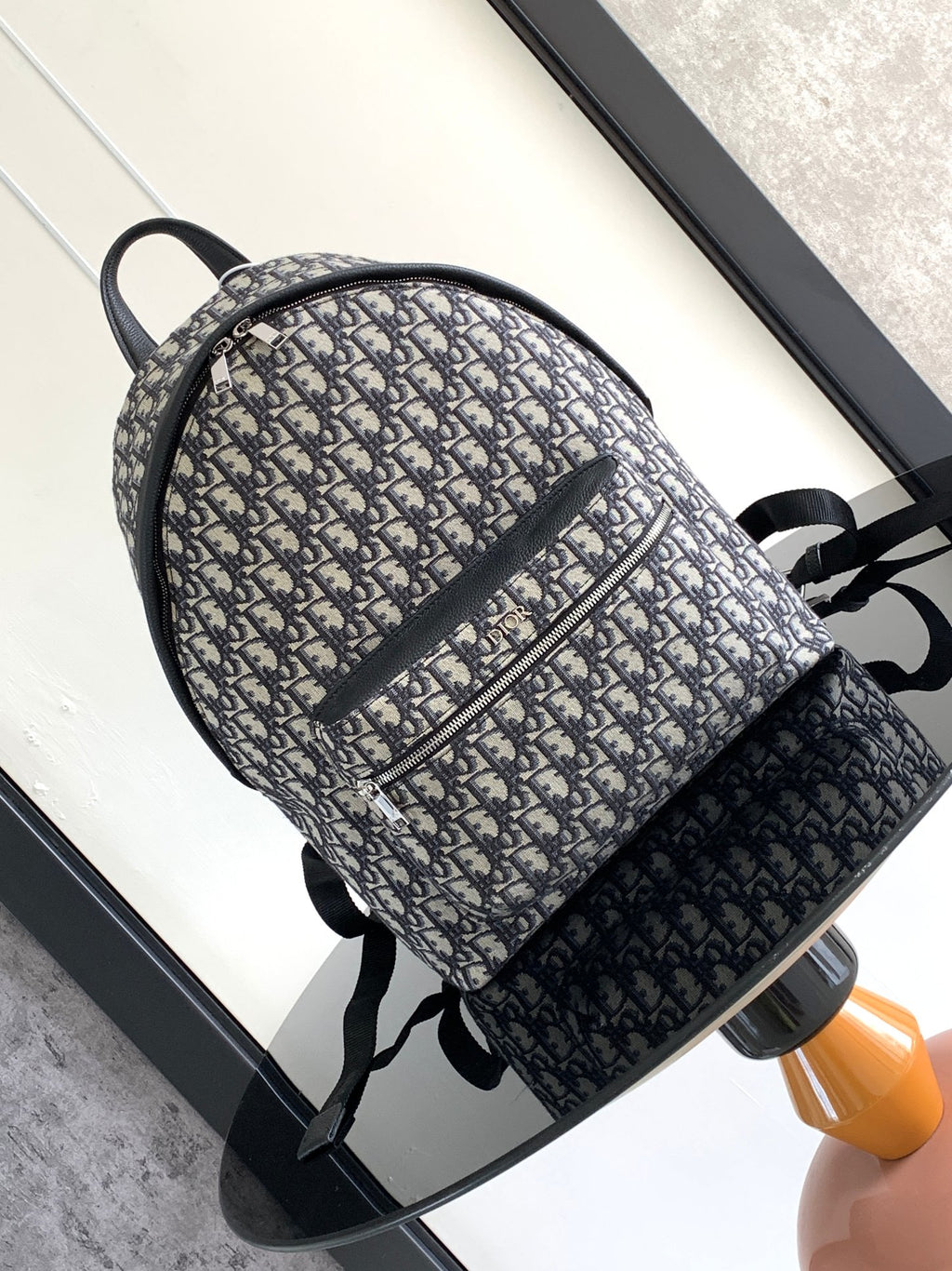 Men's Dior jacquard backpack with blue Dior pattern, black trim, top zip