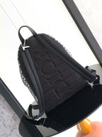 Men's Dior backpack back panel with quilted black fabric and black shoulder straps