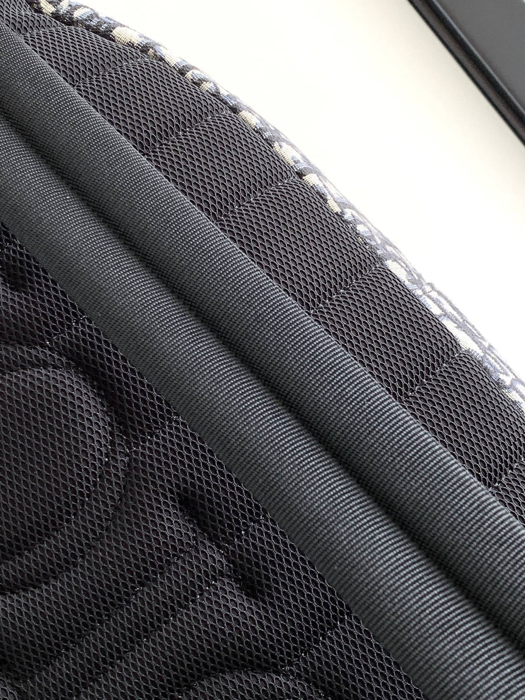 Dior monogram backpack bag interior mesh panel with black fabric texture