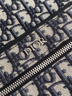 Close-up of Dior monogram jacquard fabric with silver-tone zipper teeth