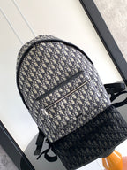Men's Dior backpack in blue-and-cream Oblique canvas with black trim and top zip