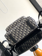 Men's Dior backpack front view with flap pocket and black crossbody-style strap