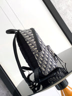 Men's Dior monogram backpack, side strap detail, zip pockets, adjustable shoulder straps.