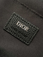 Dior logo patch on black textured lining
