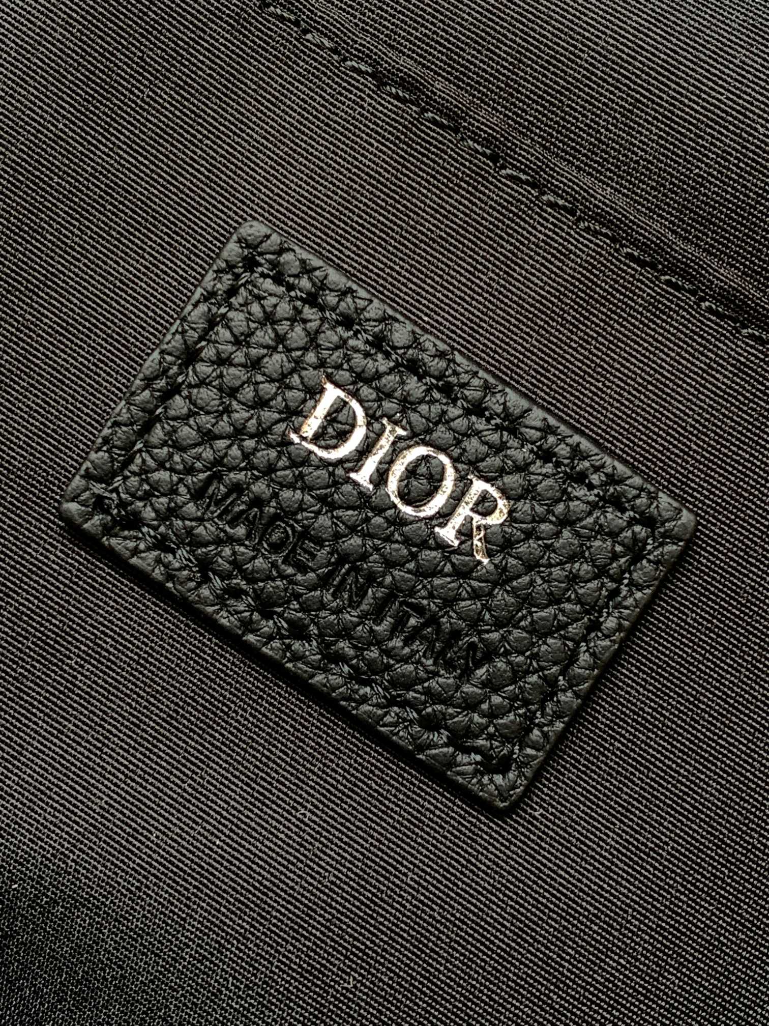 Dior logo patch on black textured lining