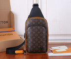 Louis Vuitton monogram sling bag with black strap and orange trim, front view.