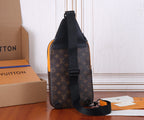 Louis Vuitton monogram crossbody bag with black strap and orange trim, side view.