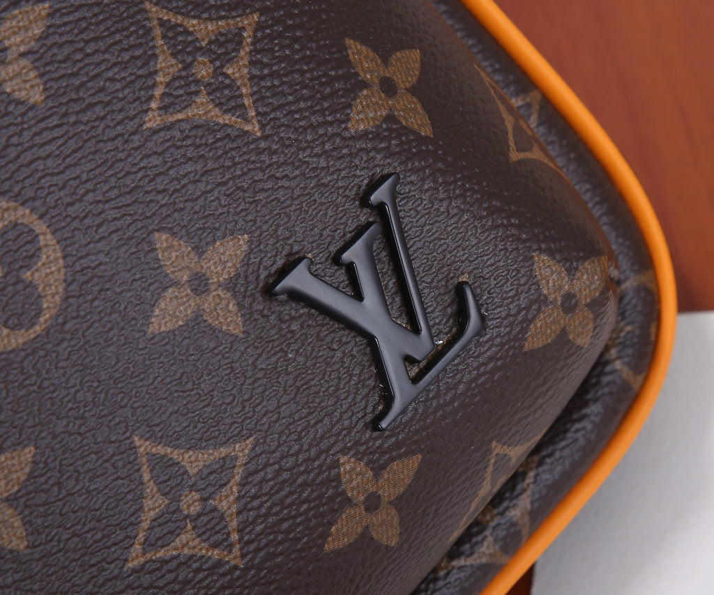 Louis Vuitton monogram bag logo detail on dark brown canvas with orange-trim edge