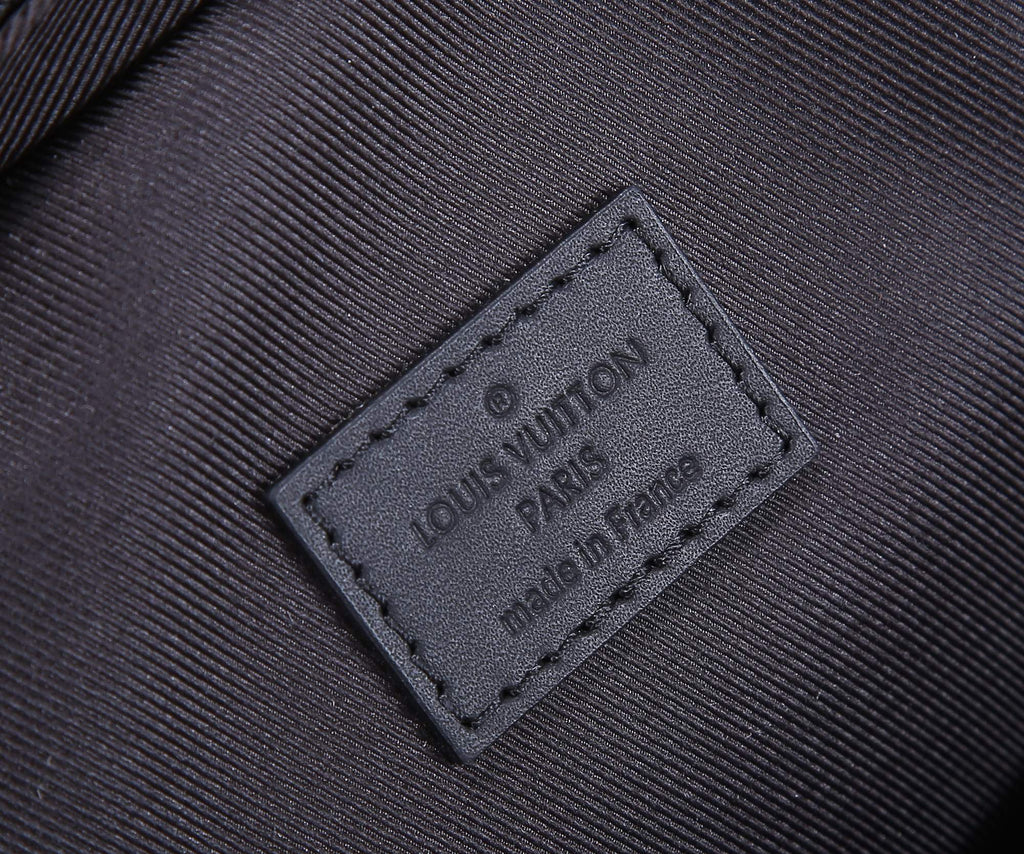 Louis Vuitton inner label patch stitched on dark fabric lining