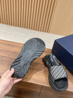 Dior monogram slide sandal outsole, textured tread sole with black upper