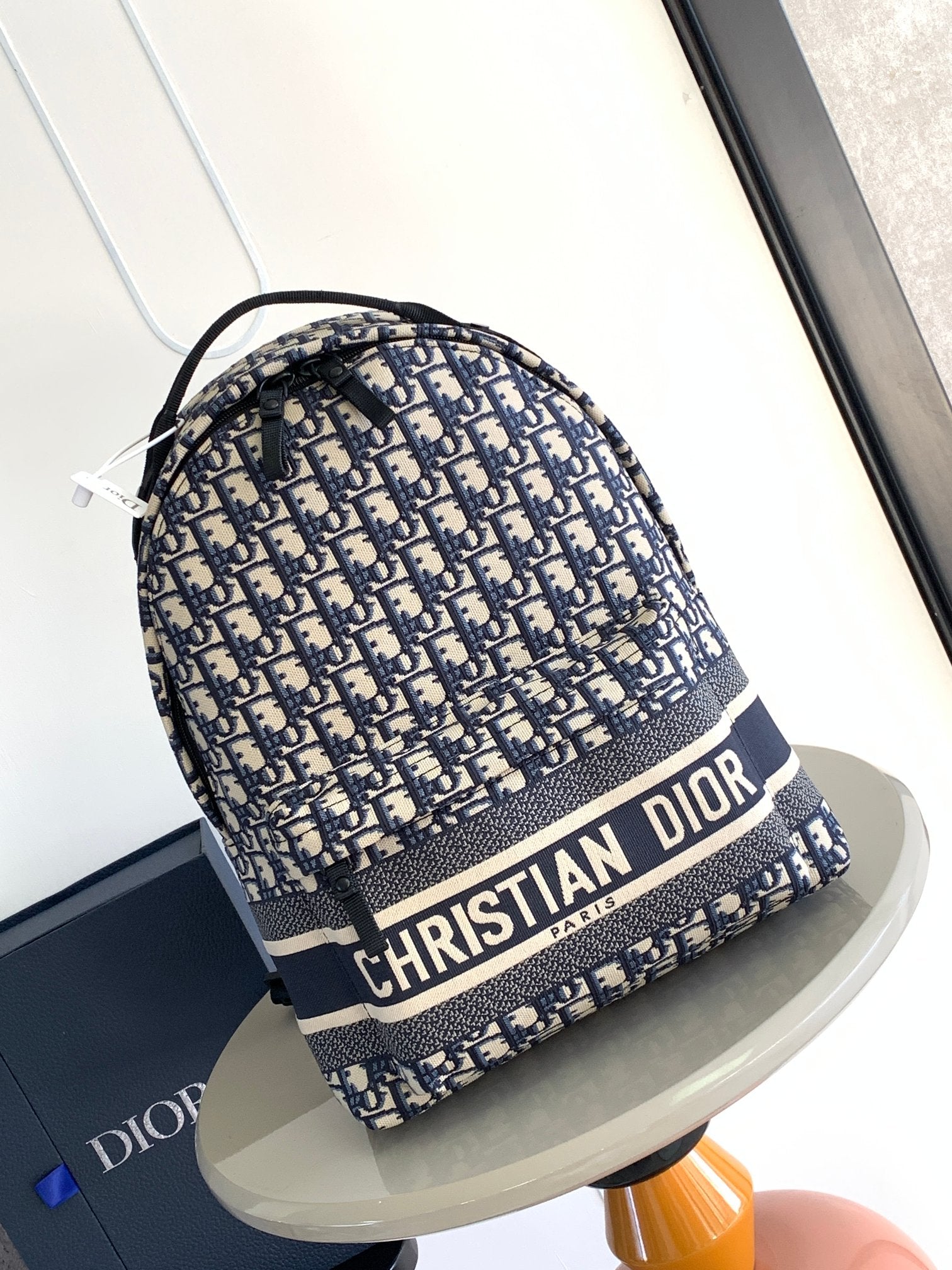 Dior mini patterned backpack, drawstring closure, navy and beige, black straps