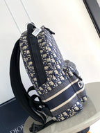 Dior mini patterned backpack side view, navy and beige, adjustable black strap