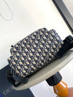 Dior men's sling-style backpack with monogram print and black adjustable strap