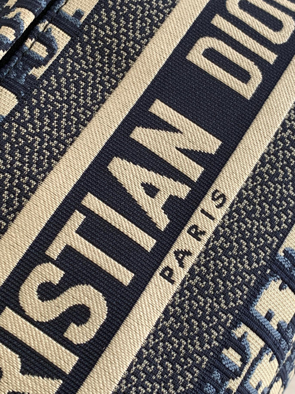Dior logo strap detail on patterned fabric, navy and beige, dark trim