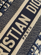 Dior logo strap detail on patterned fabric, navy and beige, dark trim