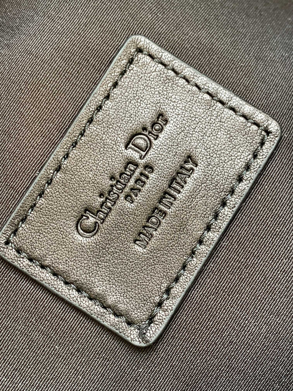 Dior leather interior label tag, debossed Dior text, beige